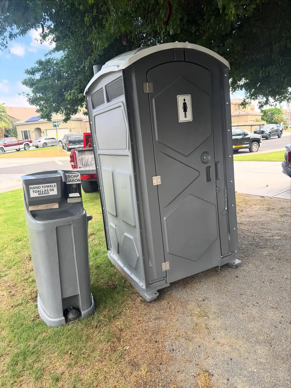 Porta potty with a foot-pump hand wash station