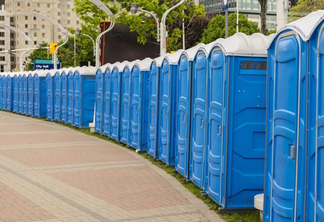 a row of portable restrooms at a fairground, offering visitors a clean and hassle-free experience in bowlinggreen